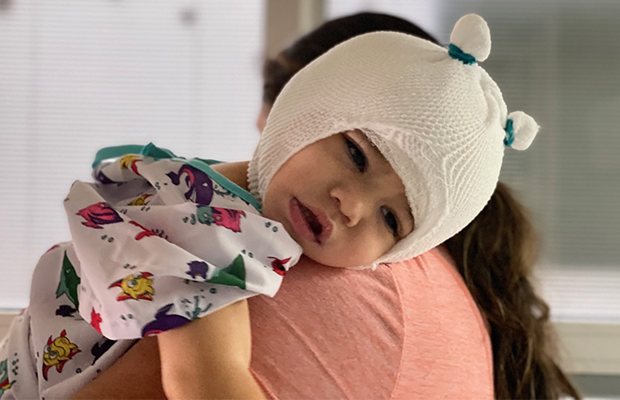 bent child leaning on shoulder